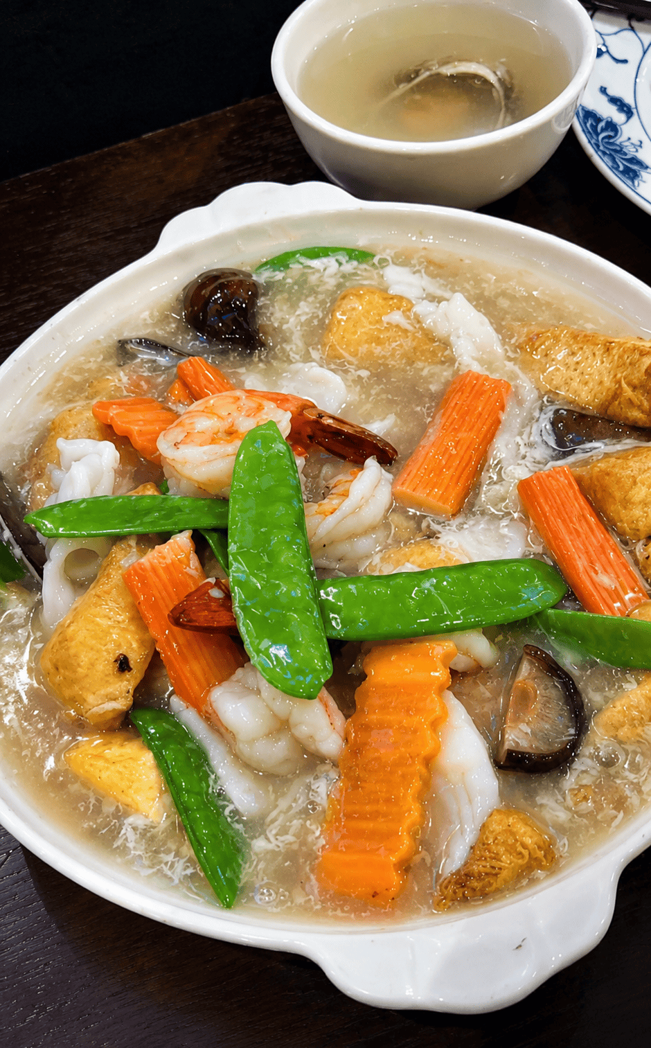 Soft silken homemade bean curd tofu casserole loaded with shrimp, squid, crab sticks, and mixed vegetables.