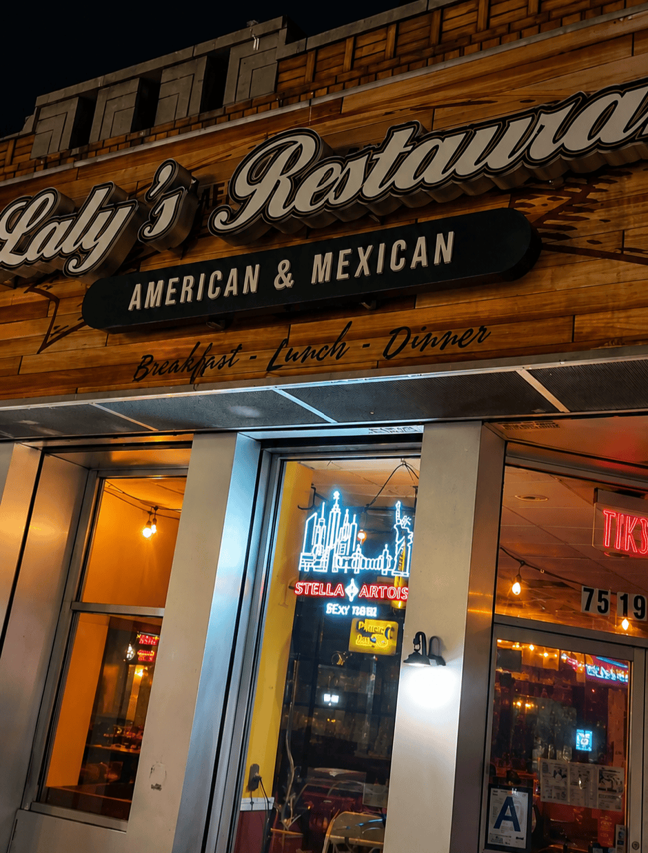 The exterior storefront and main sign of Laly's Restaurant on Roosevelt Avenue in Jackson Heights Queens