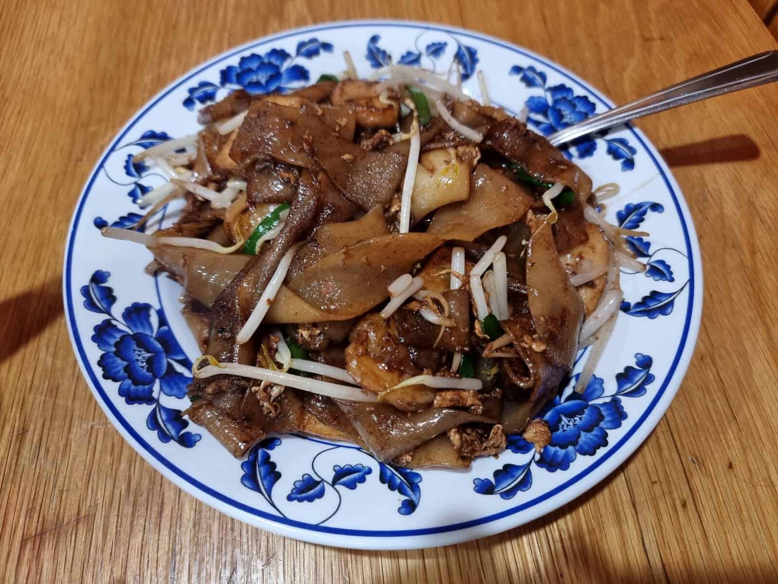 Smoky Char Kway Teow stir-fried flat rice noodles with shrimp and fish cake