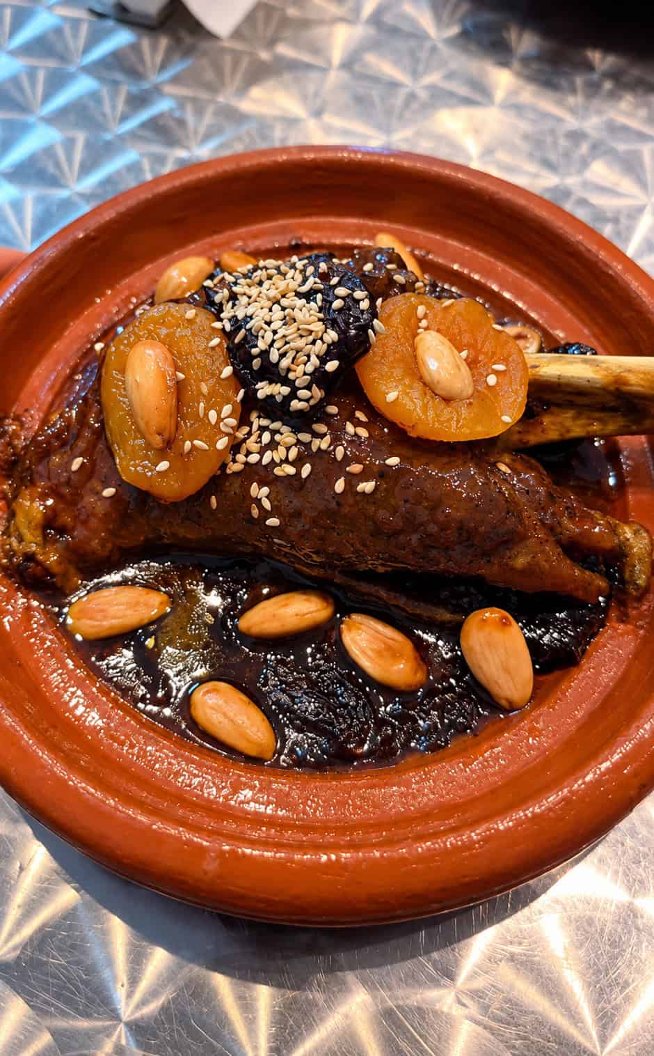 Moroccan lamb with prunes, apricots, almonds and sesame seeds at Moroccan Bites by Siham