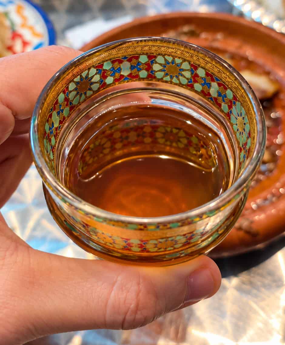 Moroccan mint tea in a decorative glass at Moroccan Bites by Siham