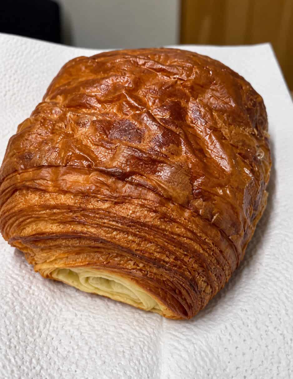 Pain au chocolat with flaky laminated pastry layers from L'Appartement 4F in Brooklyn