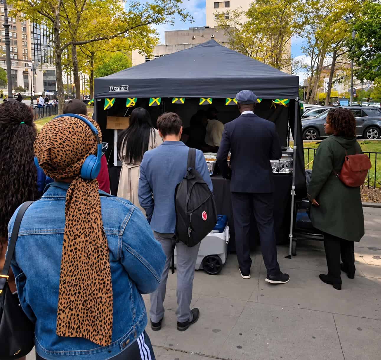 Line of office workers waiting for Jamaican lunch at Robinson Valley pop-up tent near Borough Hall Brooklyn