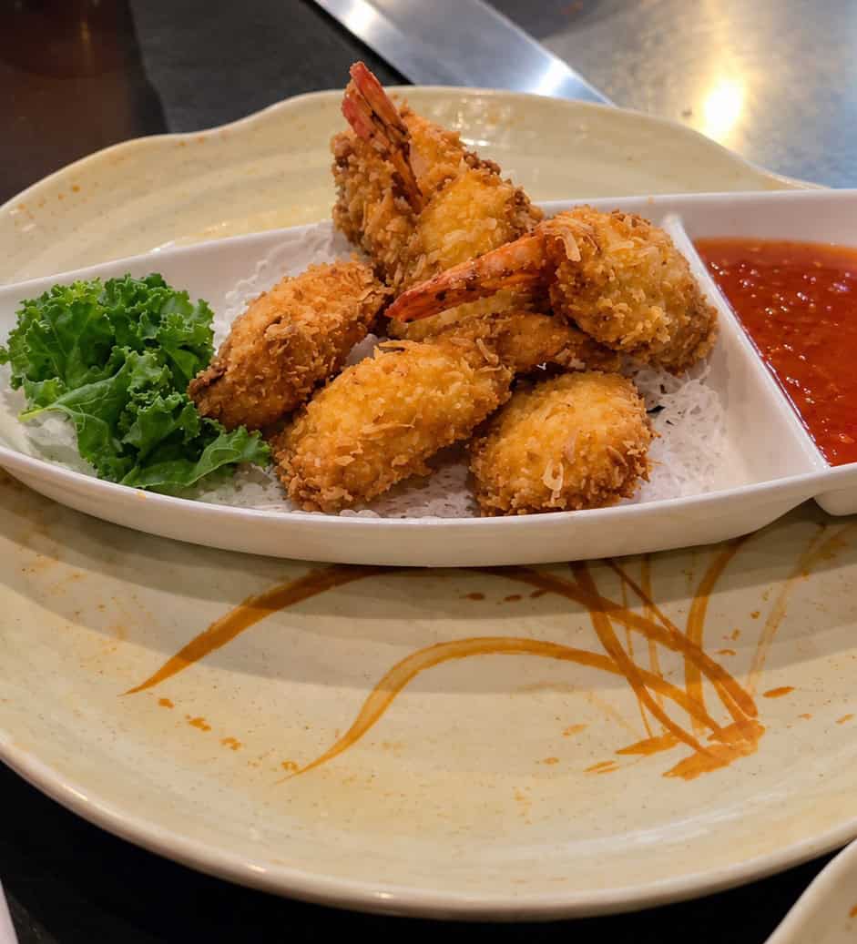 Coconut crusted fried shrimp stacked over rice noodles served with sweet chili dipping sauce