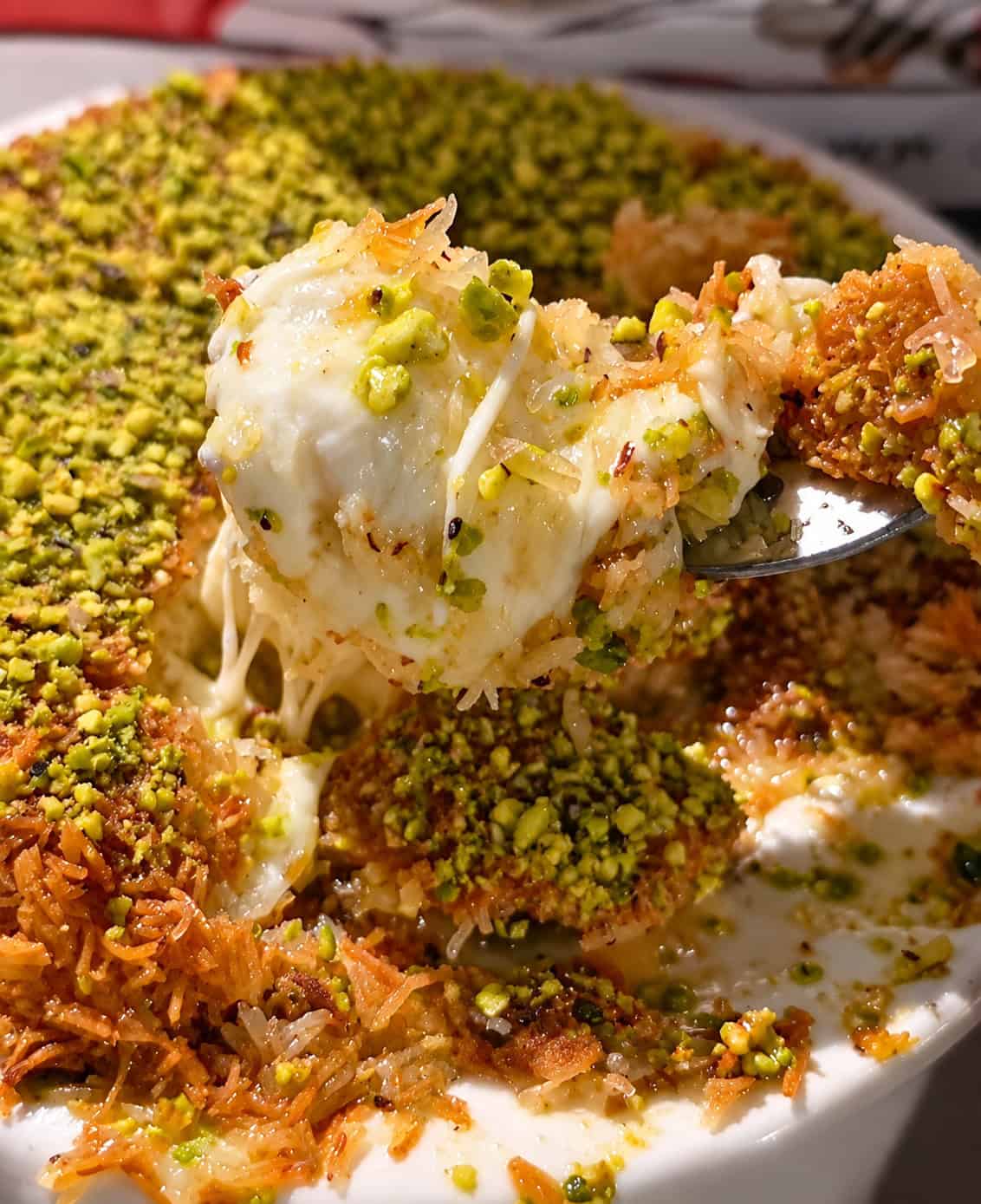 Close-up cross section of stuffed squash showing rice parsley and tomato filling on a fork