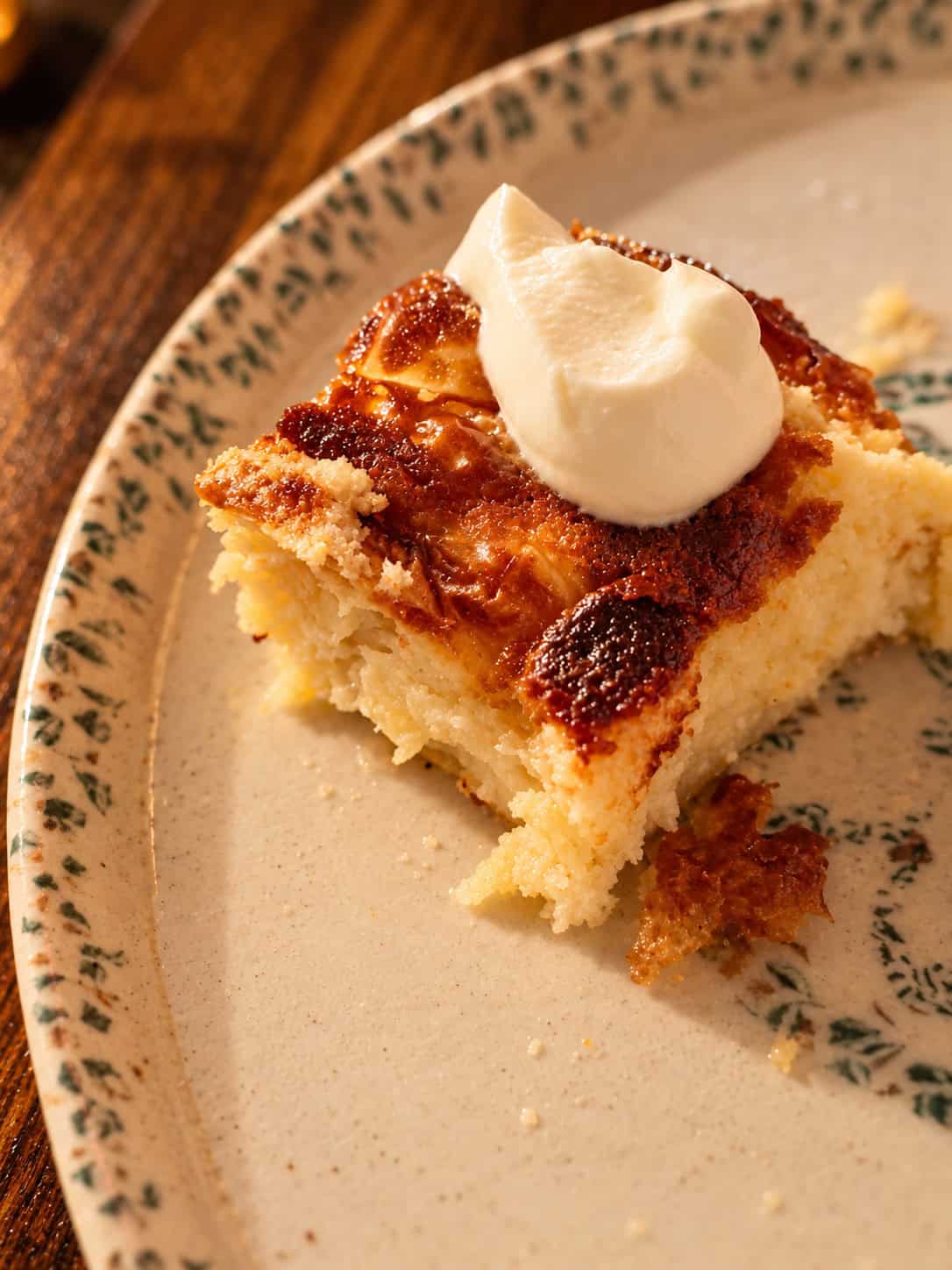 Slice of traditional Greek orange cake portokalopita topped with delicate crispy pastry flakes