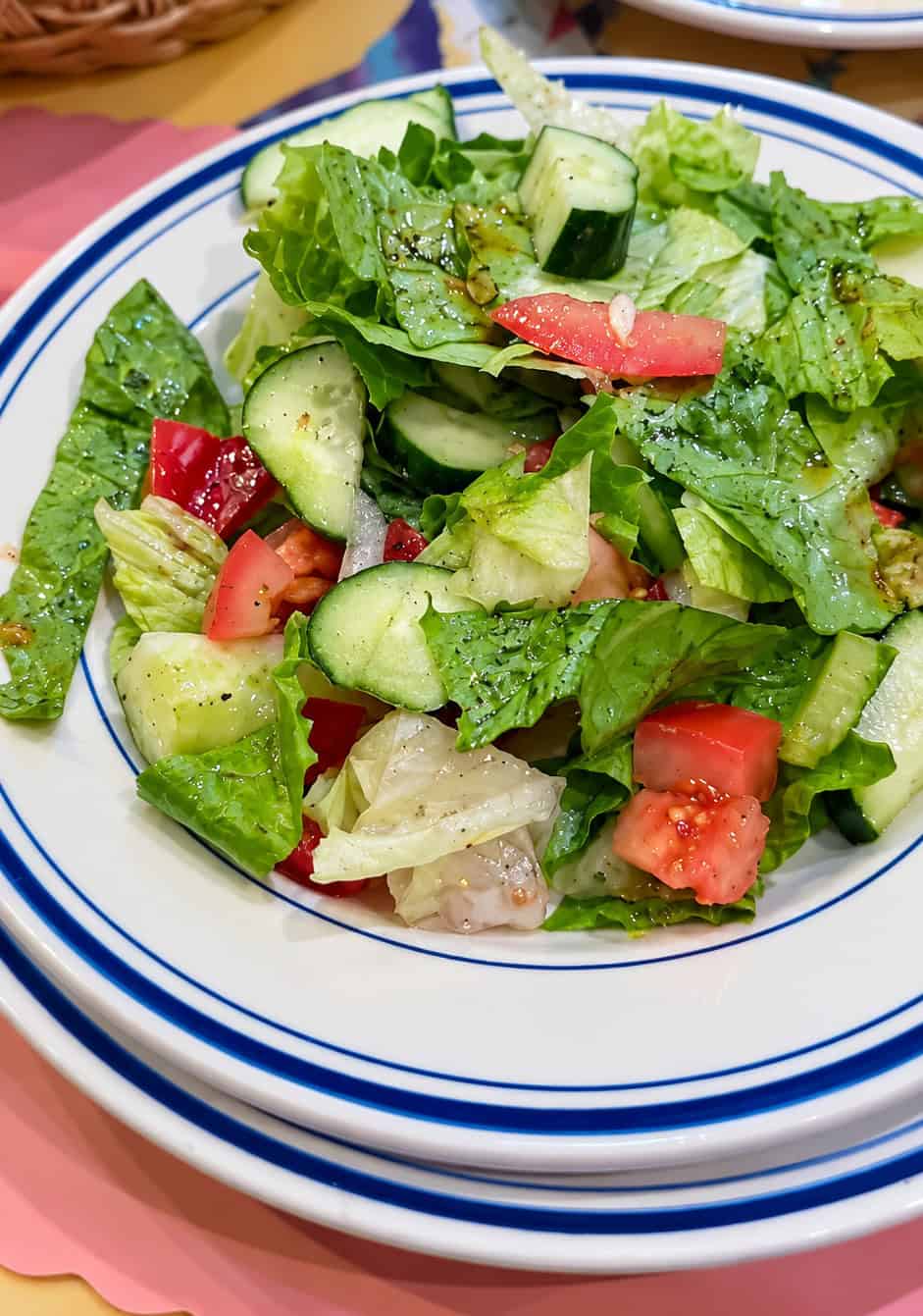 Fresh garden salad with chopped lettuce tomatoes and cucumbers