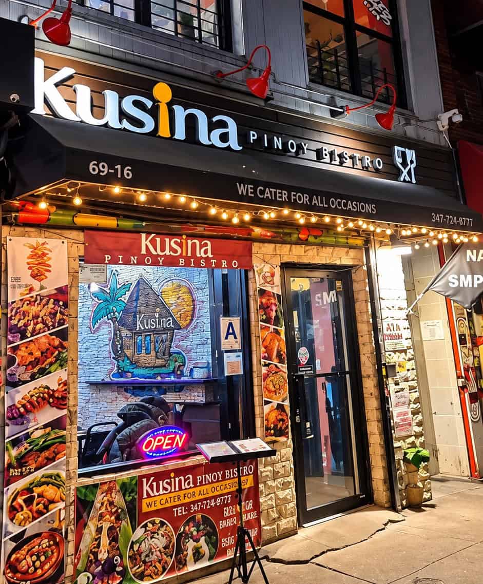 Exterior storefront and illuminated sign of Kusina Pinoy Bistro on Roosevelt Avenue in Woodside Queens