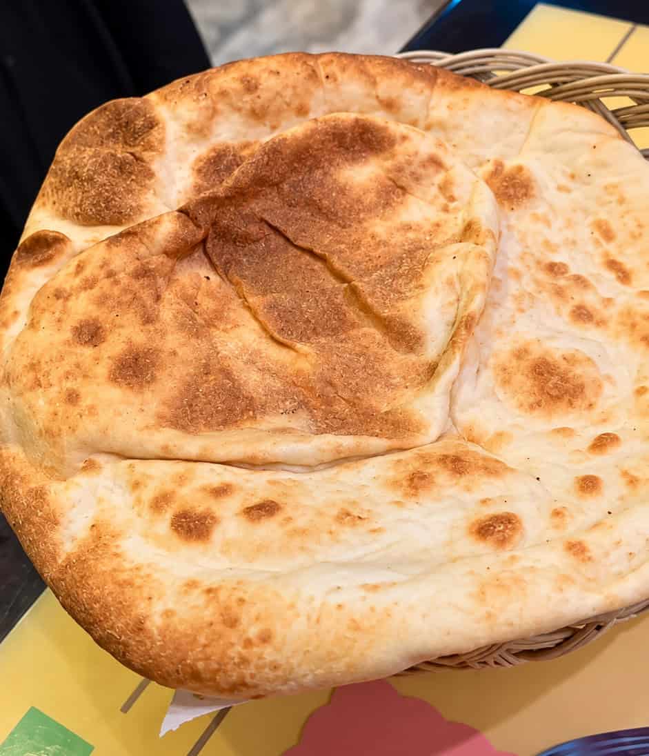 Basket of warm golden brown pita bread at Sabry's Seafood