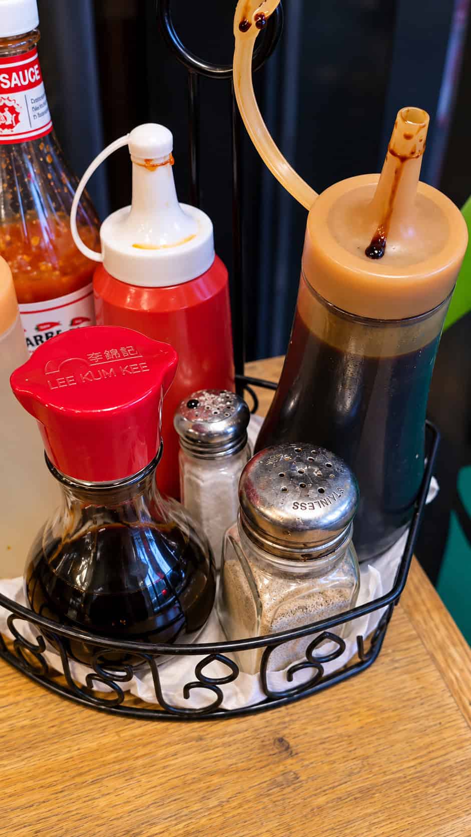 Condiments and Indonesian chili sauce on the table at Sumatera Restaurant NYC